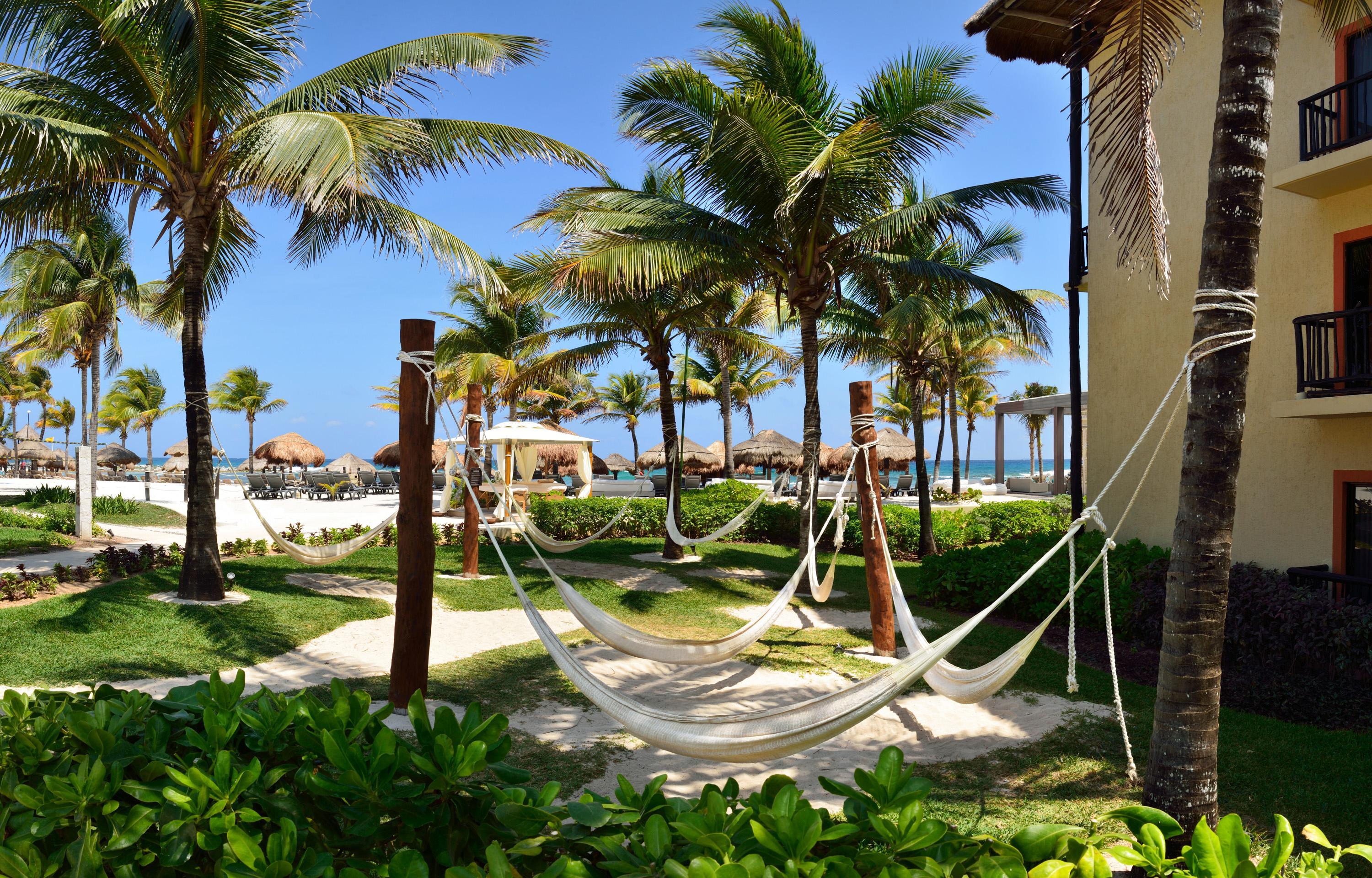 Catalonia Riviera Maya Resort & Spa Puerto Aventuras Exterior photo Hammocks at a resort in Cancun, Mexico